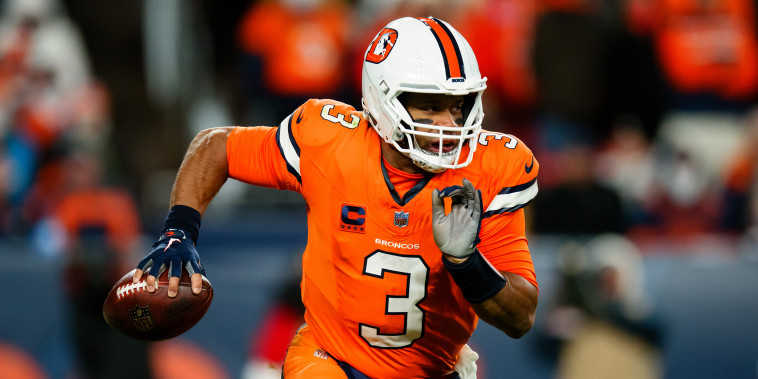 Russell Wilson of the Denver Broncos scrambles out of the pocket during the third quarter against the New England Patriots