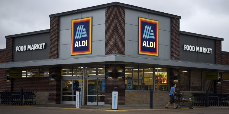 A shopper leaves an Aldi grocery store in Houston