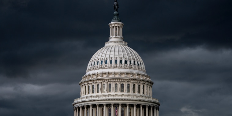 Storm clouds darken the skies above the Capitol