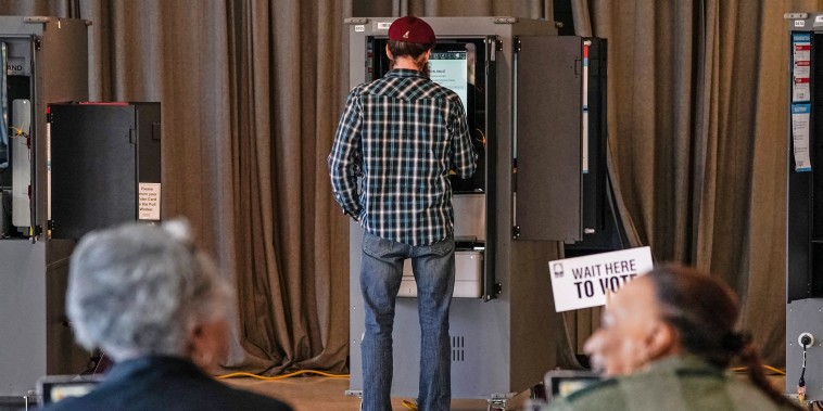 Voters cast their ballots during the Georgia presidential primary elections in Atlanta on March 12, 2024.