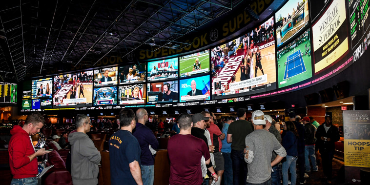 Guests line up to place bets at a viewing party for the NCAA Men's College Basketball Tournament on March 15, 2018 in Las Vegas.