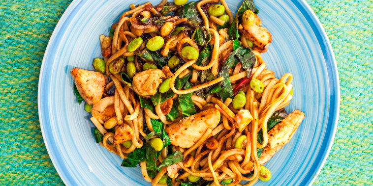 Stir fly noodles with edamame beans, and chicken.