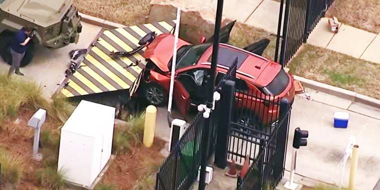 A person is in custody after allegedly ramming car into an Atlanta FBI building.