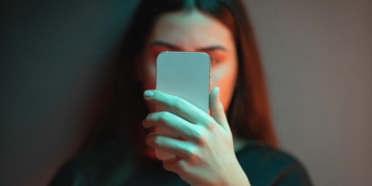 Teenage girl looking at smartphone.