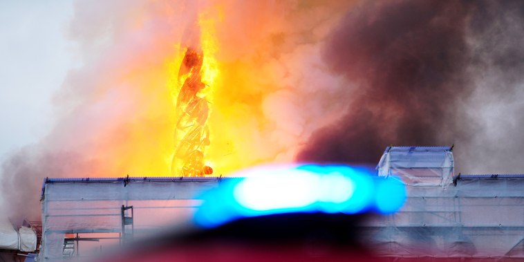 Smoke billows during a fire at the Old Stock Exchange, Boersen, in Copenhagen