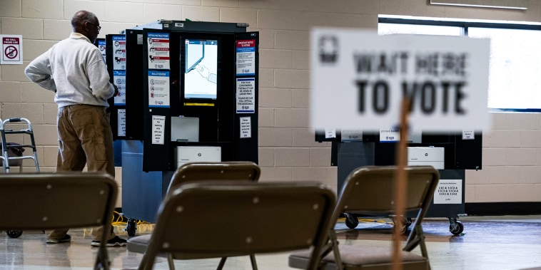 A voter casts a primary ballot at a polling place.