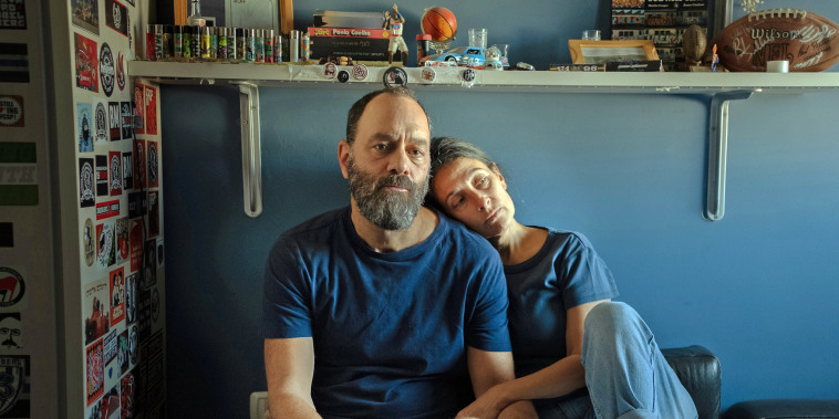 Jon Polin and Rachel  Goldberg-Polin, parents of Hersh, sit in his bedroom in Jerusalem on Oct. 26, 2023. 