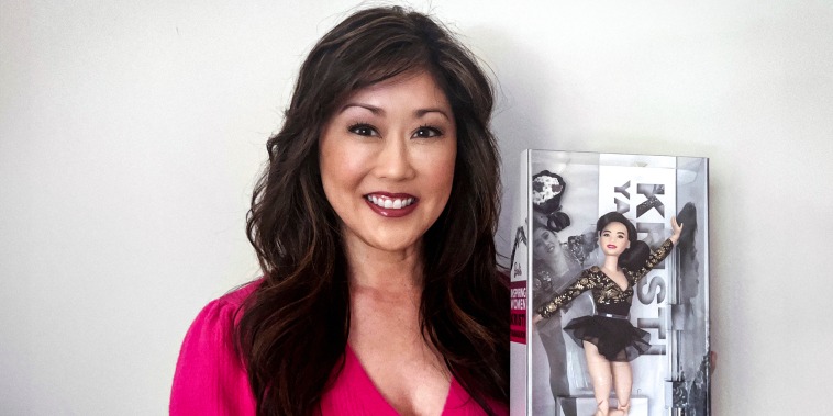 Image: Kristi Yamaguchi with the Barbie doll based on the figure skater