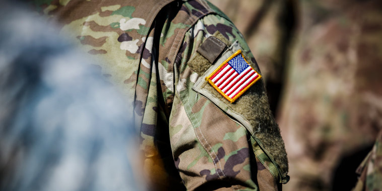 USA flag and US Army patch on solder's uniform