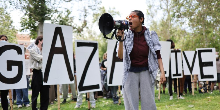 Pro-Palestine demonstrators rally at an encampment in support of Gaza at the University of Southern California