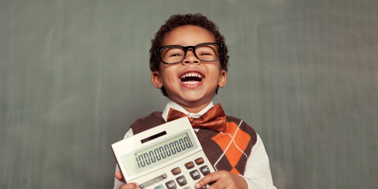 child holding calculator and laughing.