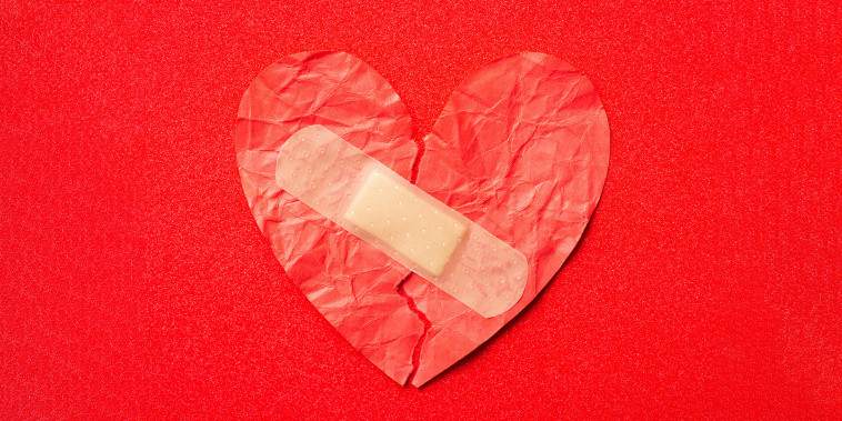 crumpled heart with a bandaid on it