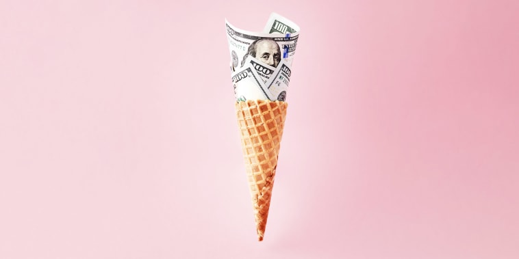 US American dollar bills in ice cream cone. Business, finance, economy, health care diabetes expenditure or consumerism