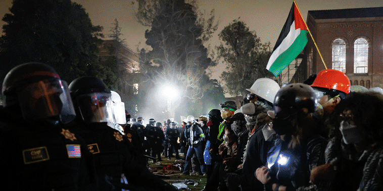 Officers forcefully enter the pro-Palestinian encampment at UCLA in Los Angeles on May 2, 2024.