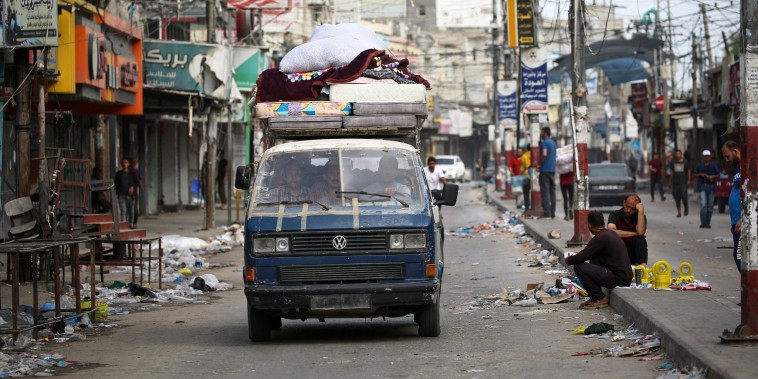 Palestinians transport their belongings on the back of a van as they flee Rafah in the southern Gaza Strip to a safer location on May 11, 2023, amid the ongoing conflict between Israel and the militant group Hamas. Israeli strikes hit Gaza on May 11 after renewed US criticism over its conduct of the war and a UN warning of "epic" disaster if an outright invasion of crowded Rafah city occurs.