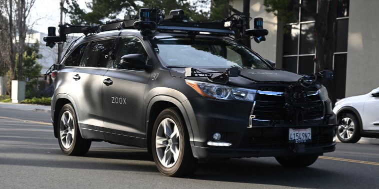 Toyota Highlander equipped with Zoox self-driving software on a street in Foster City, Calif.,