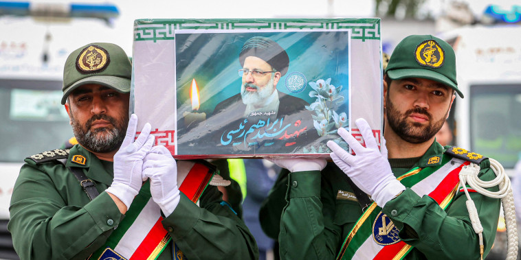 Guards carrying the coffin of late president Ebrahim Raisi 