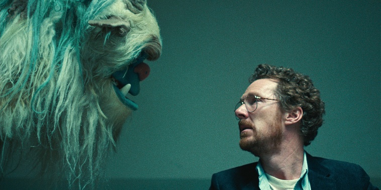 Benedict Cumberbatch and blue monster puppet.