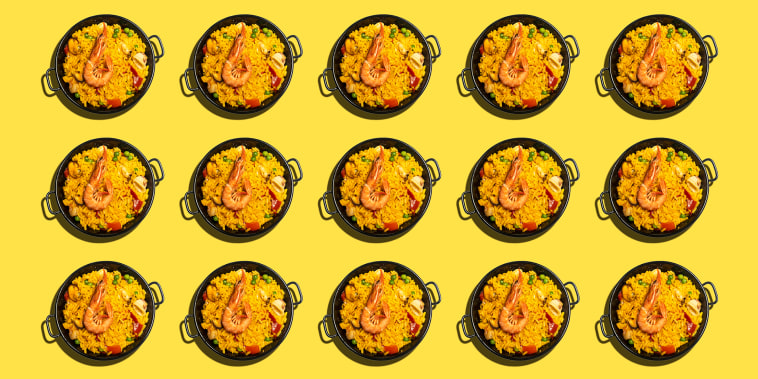 Repeated dishes of paella on yellow background.