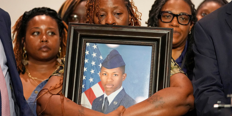 Chantemekki Fortson, mother of Roger Fortson, a U.S. Air Force senior airman, holds a photo of her son during a news conference with attorney Ben Crump, on May 9, 2024, in Fort Walton Beach, FL. Fortson was shot and killed by police in his apartment, May 3, 2024.