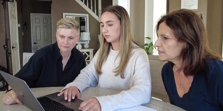 Stacey Hachenberg, left, and her partner, Sharon Fleming, right, review long-term care options with the help of Fleming’s daughter, Alexa Fleming, center.