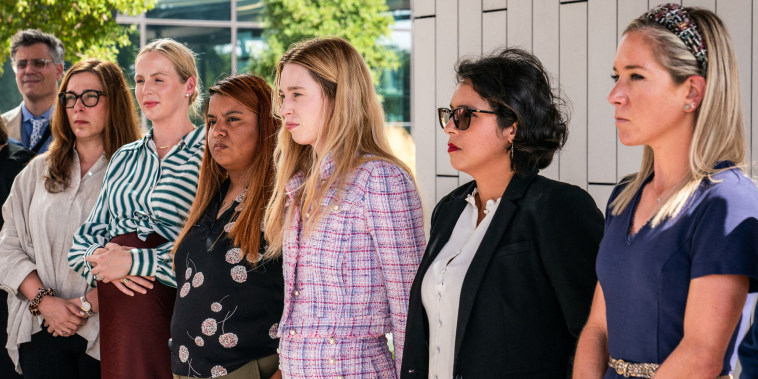 From left, Damla Karsan, Austin Dennard, Samantha Casiano, Taylor Edwards, Molly Duane, and Amanda Zurawski stand in a line and listen