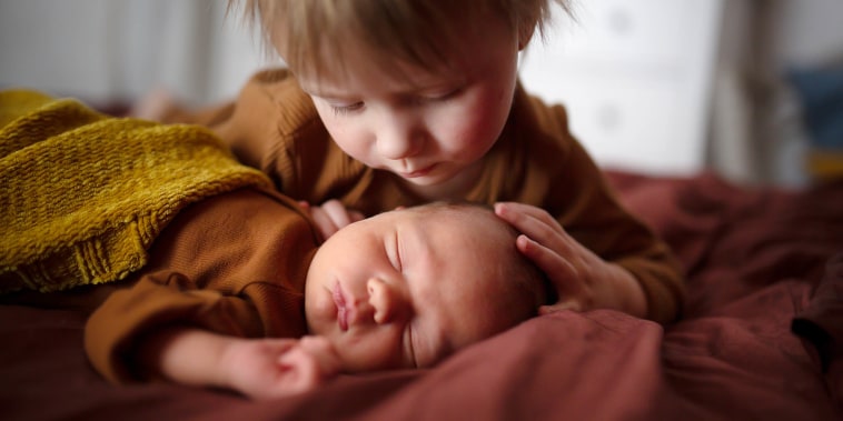 Newborn baby with older brother