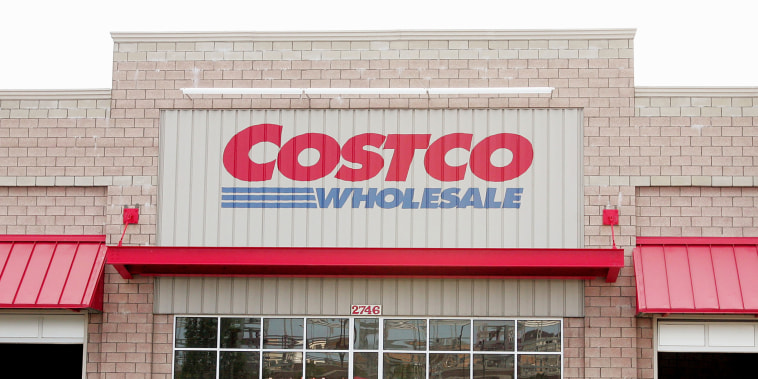 Shoppers leave the Costco Store.