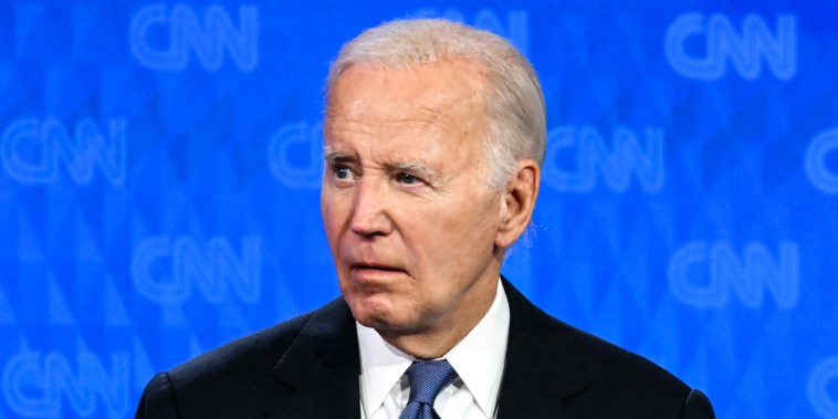 Joe Biden looks on