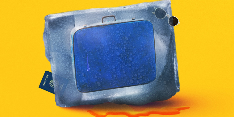 Suitcase, sunglasses and passport encased in a melting ice block. 