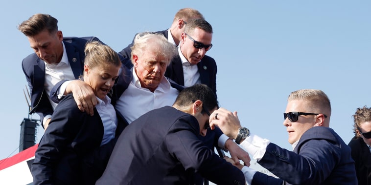 Donald Trump is rushed offstage during a rally on July 13, 2024 in Butler, Pa.