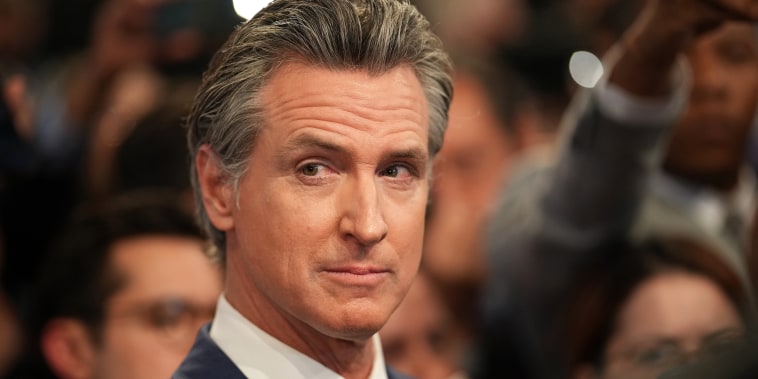 Gavin Newsom speaks to reporters in the spin room following the CNN Presidential Debate between Joe Biden and Donald Trump at the McCamish Pavilion on the Georgia Institute of Technology campus in Atlanta