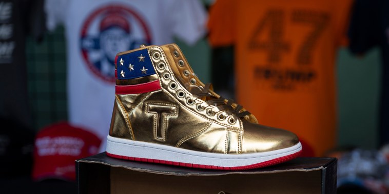 Donald Trump branded sneakers  on display in front of T-Shirts an other merchandise