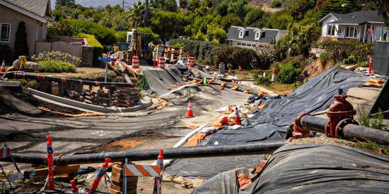 Severe landslide damage on a street