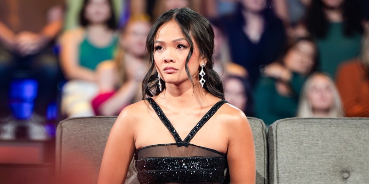 Jenn Tran sits on a couch in front of a studio audience