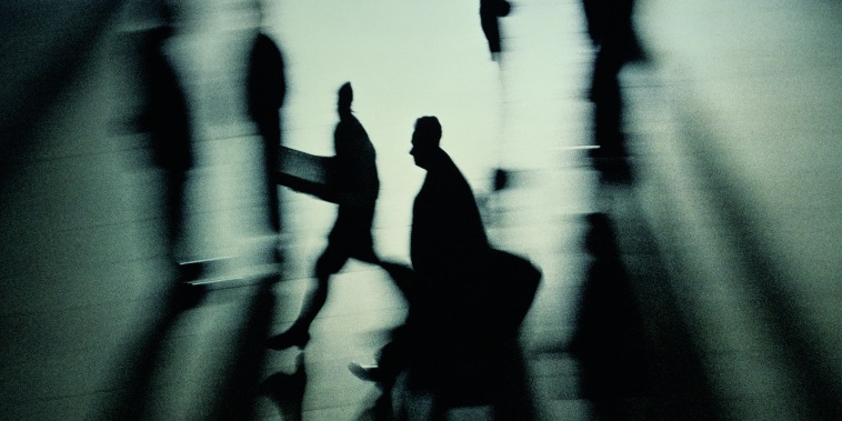 SILHOUETTES OF BUSINESS PEOPLE (BLURRED MOTION,  B&W)