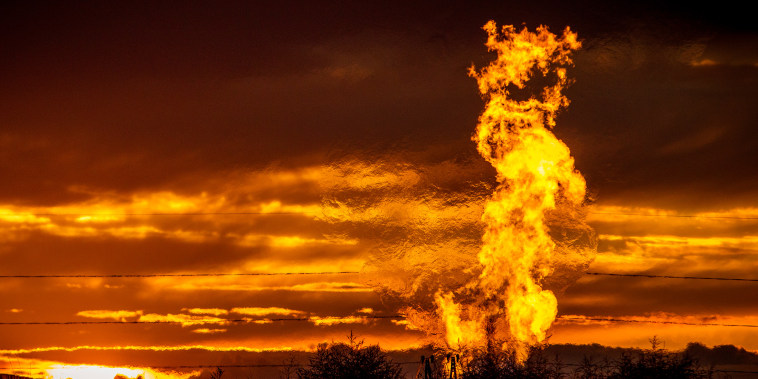 Flames from a flaring pit near a well in the Bakken Oil Field. 