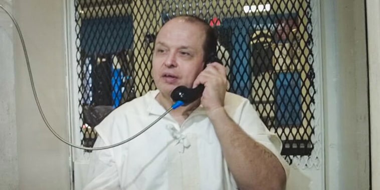 Robert Roberson speaks on the phone in jail