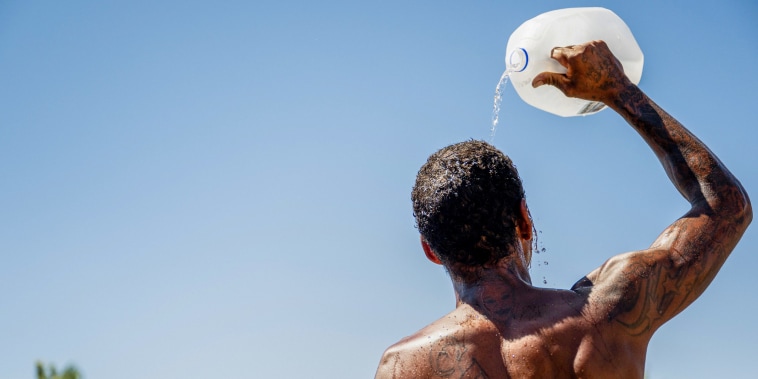  A person cools off amid searing heat.