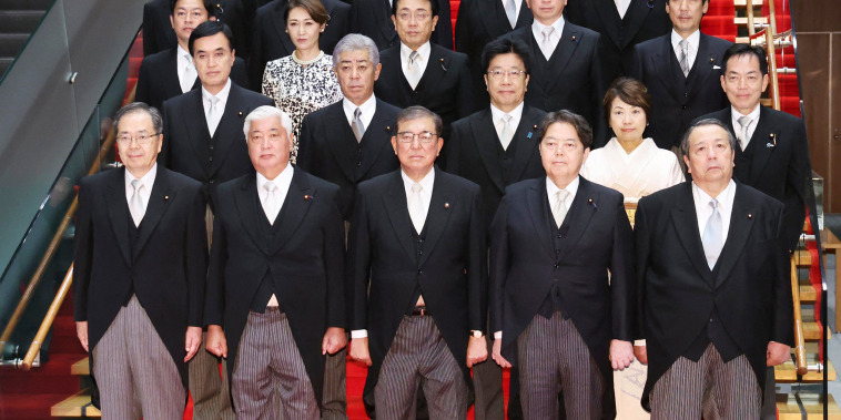 Japan's government admitted on October 7 manipulating an official photo of the new cabinet to make its members look less unkempt, after online mockery of their sagging trousers. In the official photo issued by Ishiba's office, these blemishes had mysteriously disappeared, but not quickly enough to stop a barrage of mockery of the "untidy cabinet" on social media. 