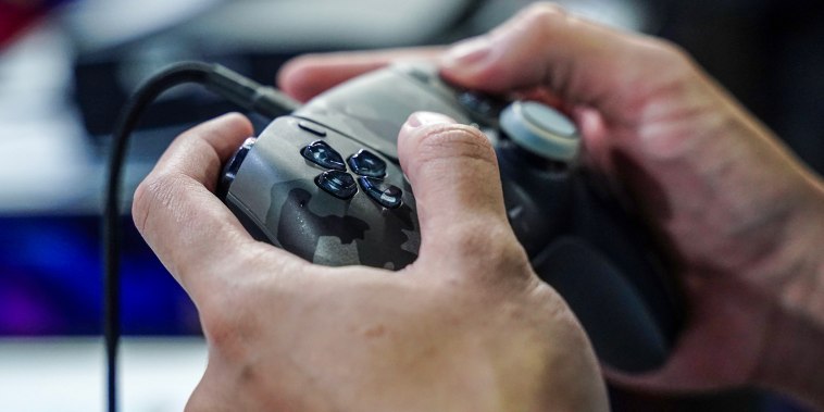 A person plays with the console.