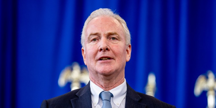 Chris Van Hollen speaks at a podium