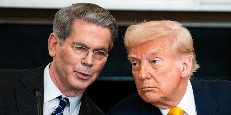 Scott Bessent, left, speaks with President Trump