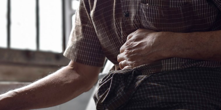 Person suffering from abdominal pain