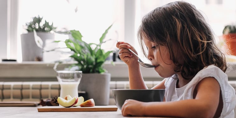 Girl eating breakfast