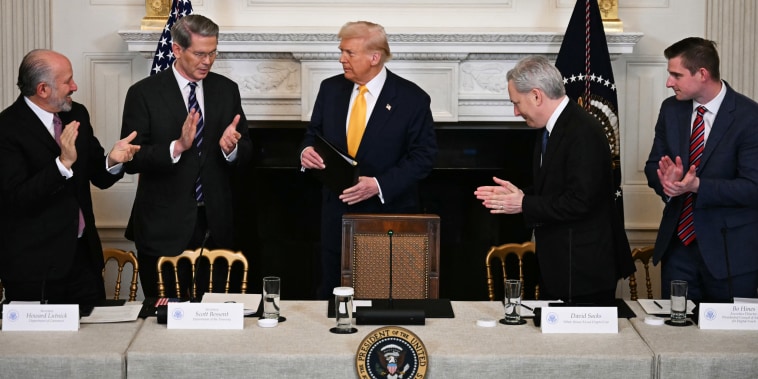 Attendees applaud Donald Trump