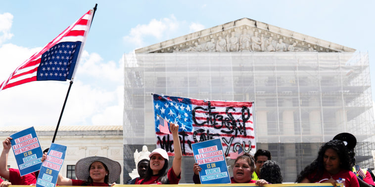 Demonstrators holds a banner  that reads, "Birthright Citizenship is a Constitutional Right"