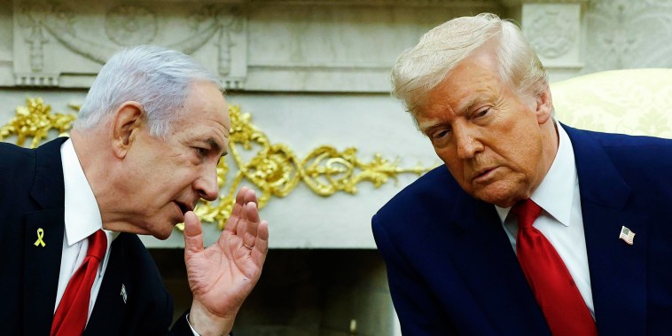 Israeli Prime Minister Benjamin talks to President Donald Trump during a meeting in the Oval Office on April 7, 2025.