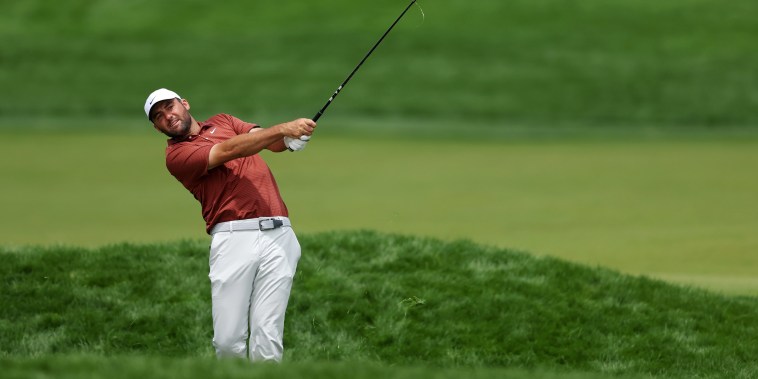 Image: Scottie Scheffler of the United States plays a shot 