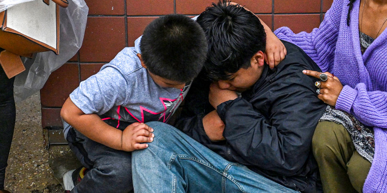 Kids being consoled.